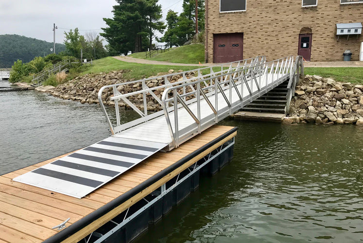 Aluminum gangway ramp leading to floating boat dock