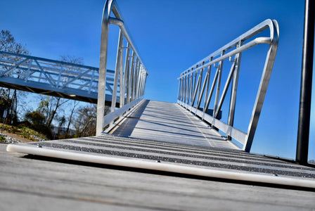 Sturdy aluminum gangway attached to a boat slip