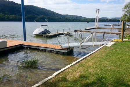Aluminum gangway ramp providing transition to the water.