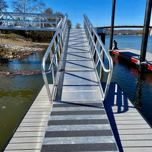 Floating boat dock system with durable aluminum gangway