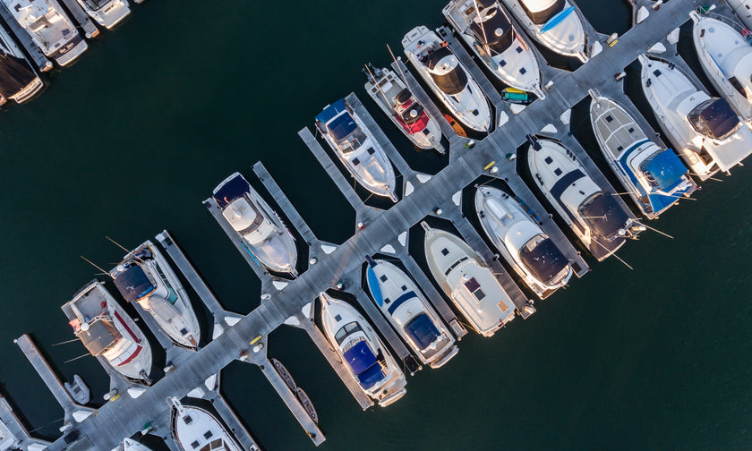 Heavy-duty marina dock accommodating multiple large vessels