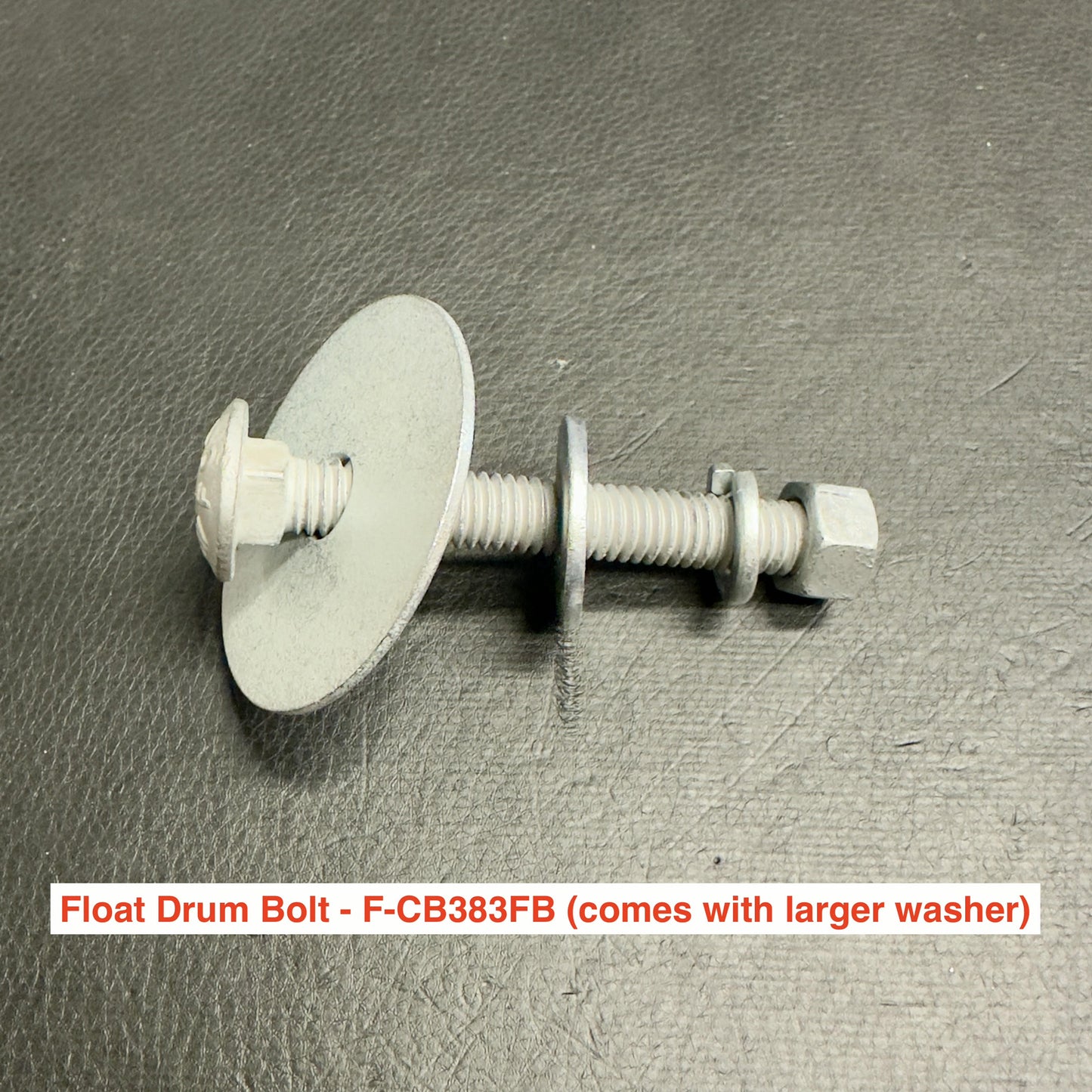 A HDG Carriage Bolt Set by American Muscle Docks & Fabrication with a larger washer, a smaller washer, and a nut is pictured on a dark textured surface. Ideal for dock hardware or waterfront construction projects.