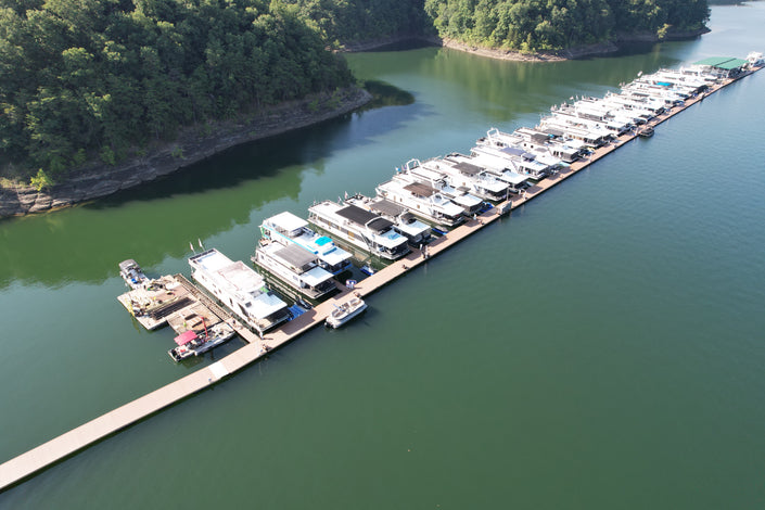 Aerial view of a marina with boats docked American Muscle Docks
