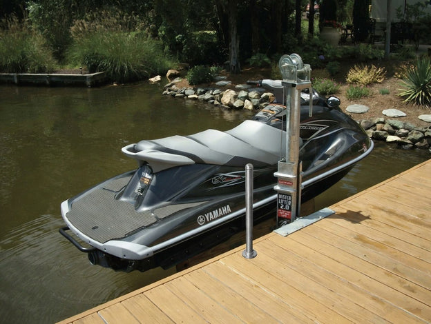 Yamaha jets ski on a Mr Lifter manual crank docked with water and greenery in the background