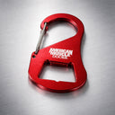 The Carabiner Bottle Cap Opener by American Muscle Docks is a durable red metal tool with a built-in bottle opener, ideal for multi-use convenience.