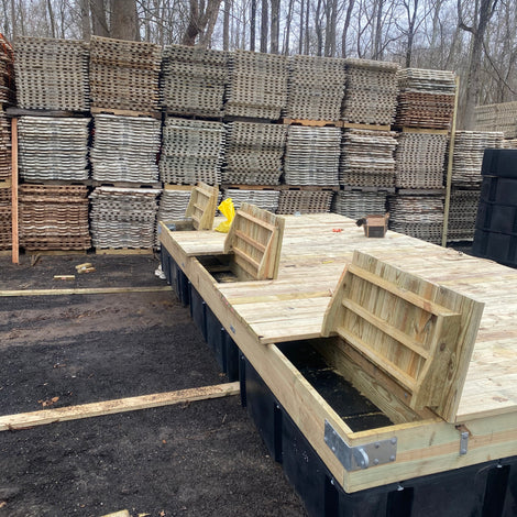 custom floating dock with wood decking and hinged compartments built by American Muscle Docks
