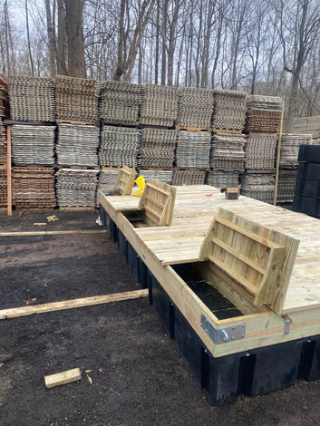 custom floating dock with wood decking and hinged compartments built by American Muscle Docks
