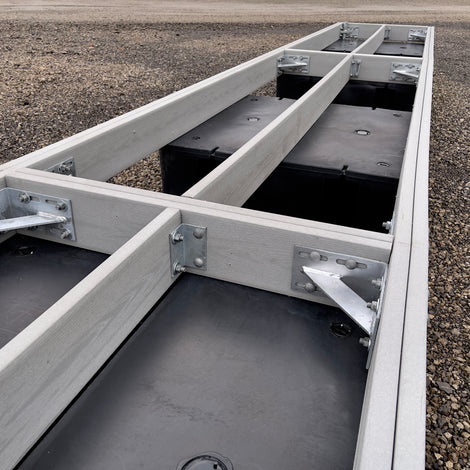 composite dock frame with floats sitting in shipping yard built by American Muscle Docks