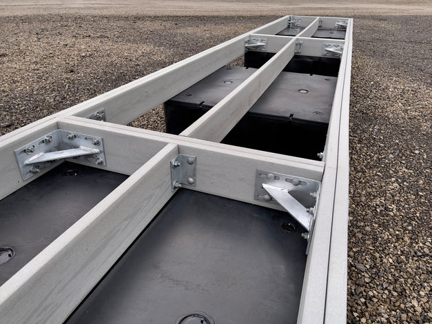 composite dock frame with floats sitting in shipping yard built by American Muscle Docks