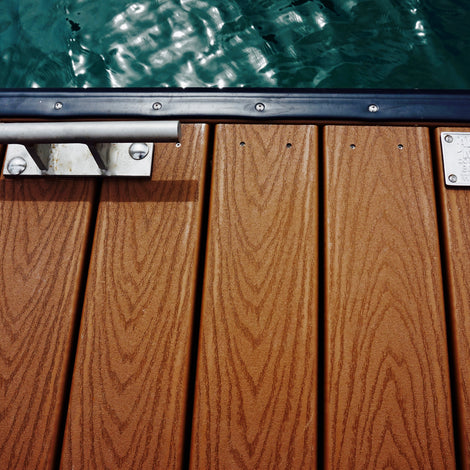 wood dock floating in the water with cleat and plaque built by American Muscle Docks