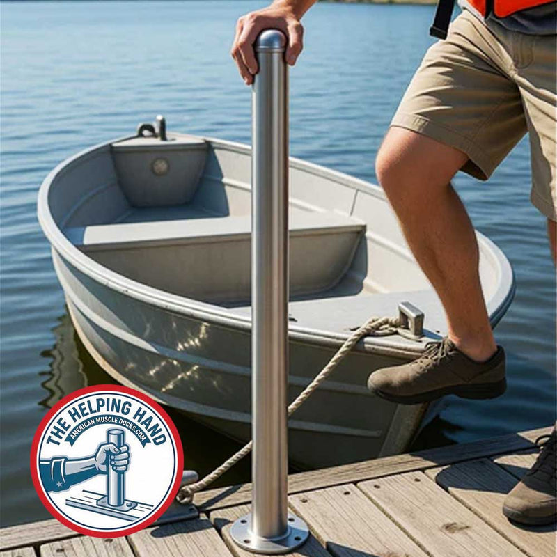 A person uses the Helping Hand Post - High-Five 40 inch by American Muscle Docks & Fabrication for support while boarding a small boat at the dock; the Helping Hand logo appears in the corner.