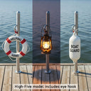 Three maritime accessories attached to the Helping Hand on a dock with water in the background.