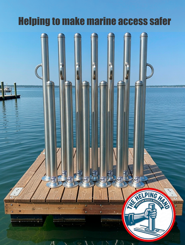 Several metal handrails are installed on a floating dock over water, with the text Helping to make marine access safer and a logo reading The Helping Hand.