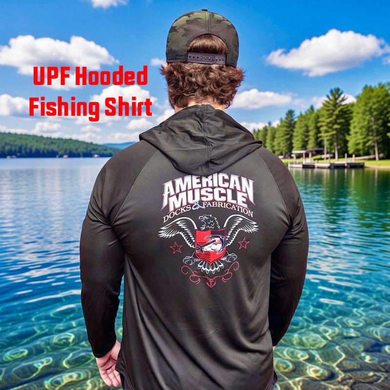 A man in an American Muscle Docks AMD Cooling Performance UPF Tee (L/S) with Hood stands by a lake with trees behind him. The shirt's name, "AMD Cooling Performance UPF Tee (L/S) with Hood," appears beside him.