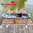 Mr. Launcher kayak launch system on a wooden dock with water background
