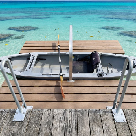 Kayak on a wooden dock with clear turquoise water in the background