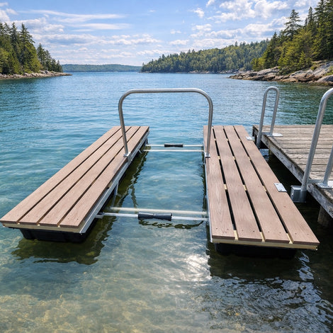 A floating dock with a metal frame extends into a clear blue lake, surrounded by forested shoreline and partly cloudy sky.