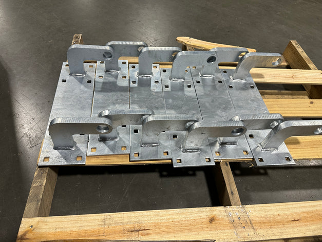 Heavy duty Metal bracket assembly on a wooden pallet built by American Muscle Docks